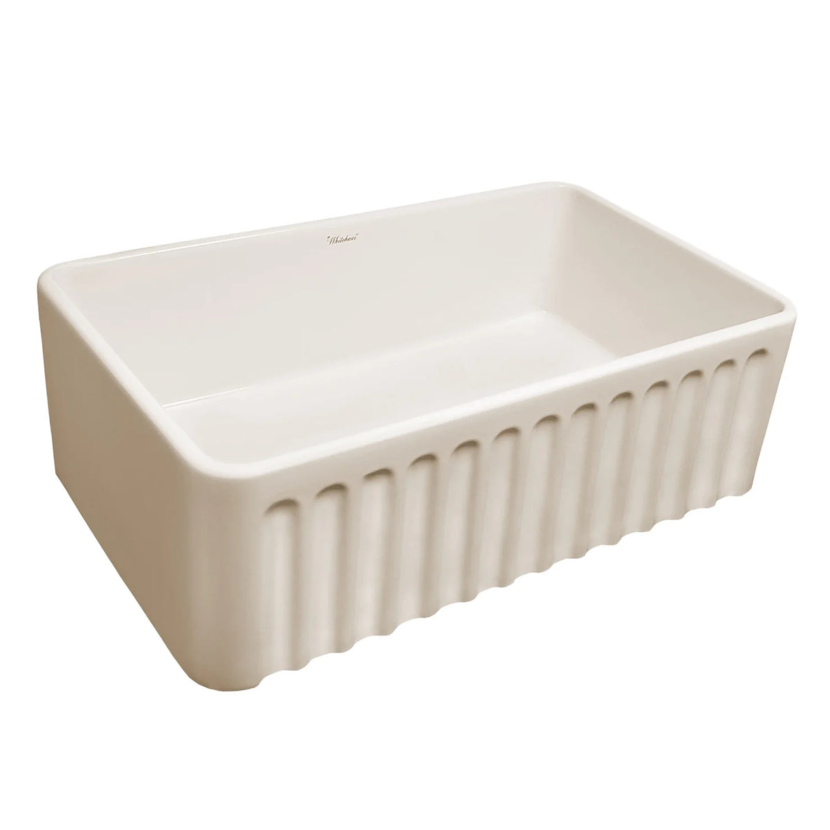 Farmhaus Fireclay Reversible Sink with a Gothichaus Swirl Design Front Apron on One Side, and a Fluted Front Apron on the Opposite Side.